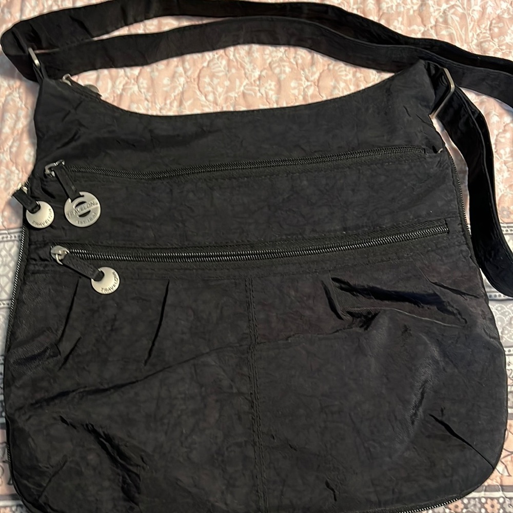 Travelon anti-theft crossbody black bag in new condition.